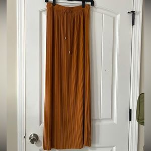 Pleated mustard orange skirt.